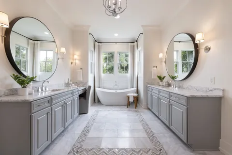 a bedroom with a large bed and a flat screen tv