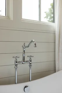 a view of empty room with wooden floor and windows