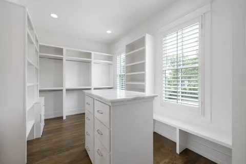 a view of house with a yard and sitting area