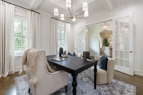 a living room with furniture a window and a fireplace