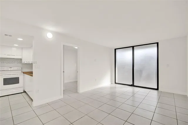 an empty room with mirror