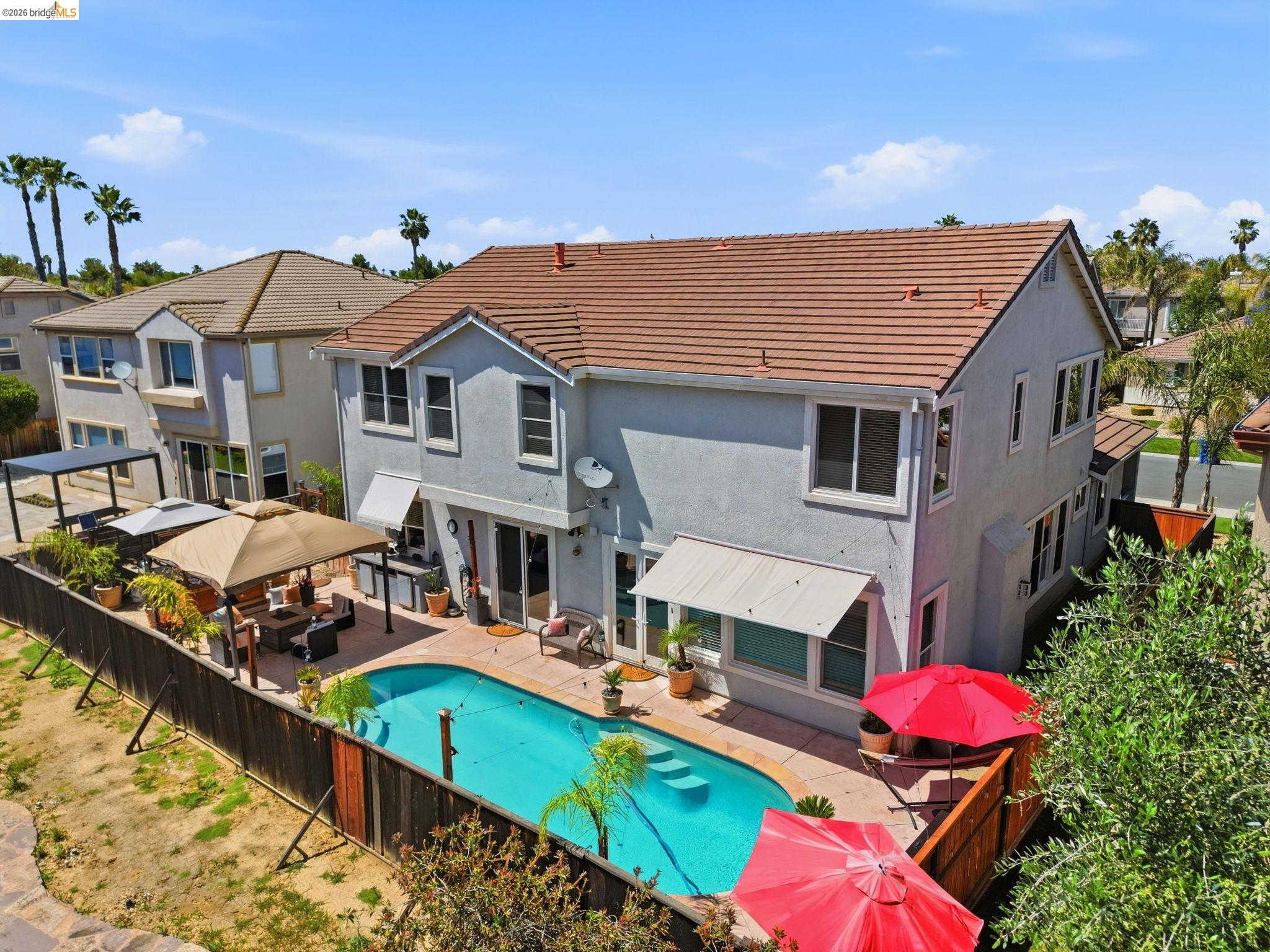 3438 Keystone Loop Discovery Bay, CA 94505 - Photo 52 of 57 a view of a house with roof deck and a garden