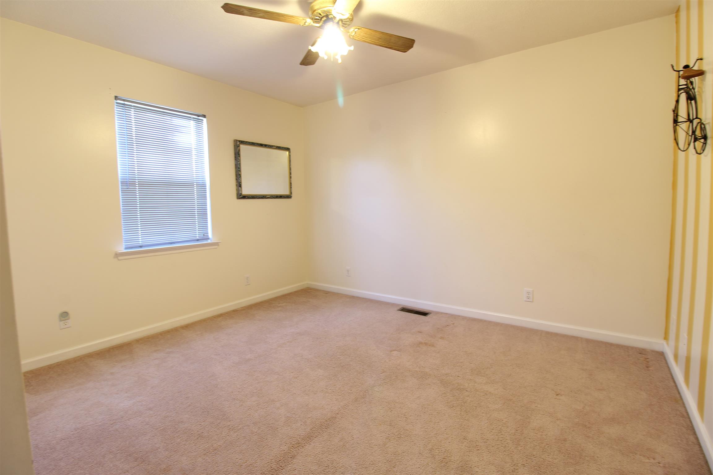 176 Simons Boulevard Morrison, TN 37357 - Photo 15 of 21 an empty room with a window and a fan