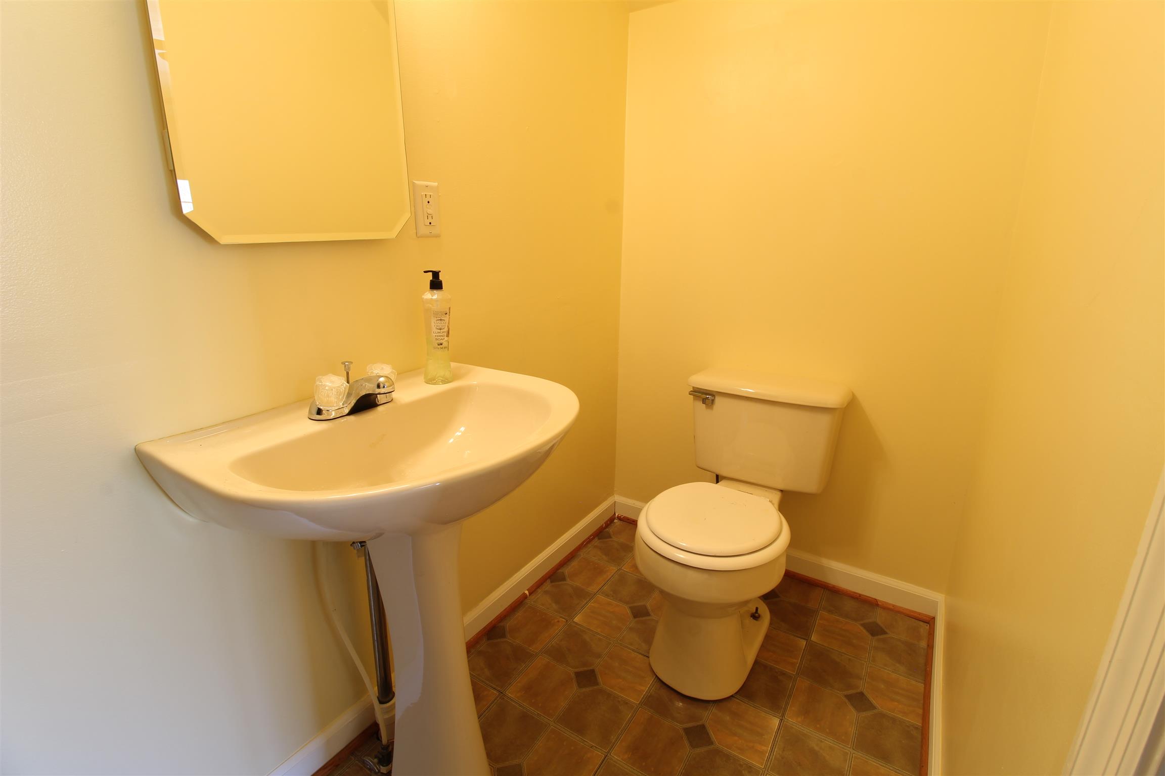 176 Simons Boulevard Morrison, TN 37357 - Photo 19 of 21 a bathroom with a sink and a toilet