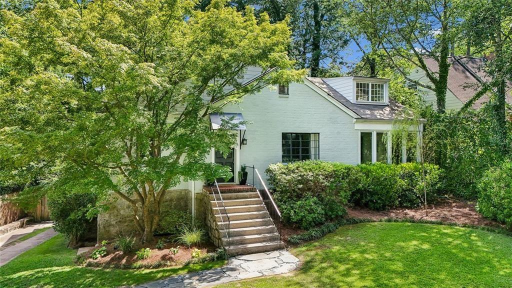 2069 Edinburgh Terrace Northeast Atlanta, GA 30307 - Photo 4 of 72 a view of a house with a yard and potted plants