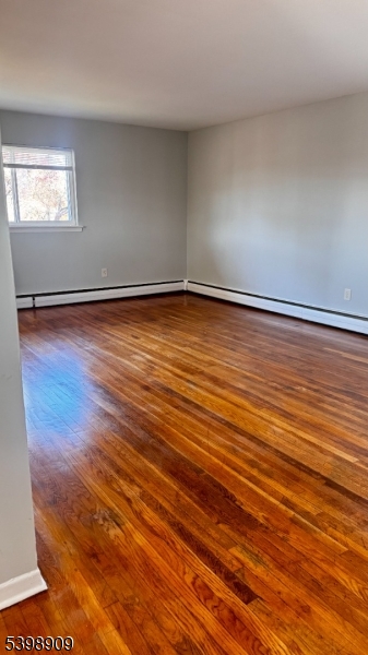 1 Swede Mine Road Rockaway, NJ 07866 - Photo 4 of 9 an empty room with wooden floor and windows