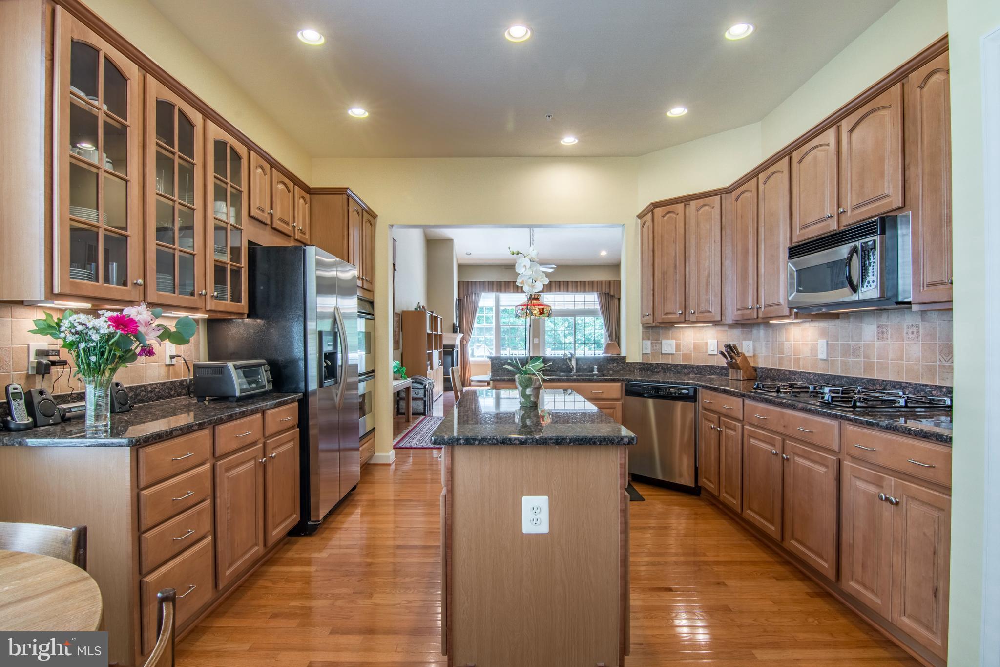 8427 Meadowsweet Road Baltimore, MD 21208 - Photo 7 of 30 KITCHEN W/ GRANITE COUNTERS & ISLAND
