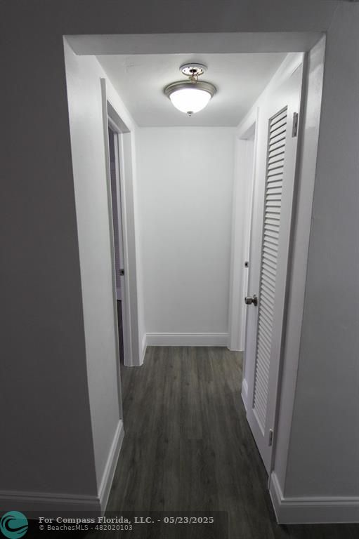 9159 Southwest 77th Avenue, Unit 411 Miami, FL 33156 - Photo 11 of 18 a view of hallway with wooden floor