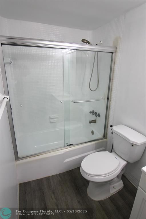 9159 Southwest 77th Avenue, Unit 411 Miami, FL 33156 - Photo 12 of 18 a white toilet and shower