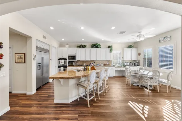 a spacious bedroom with a bed and furniture