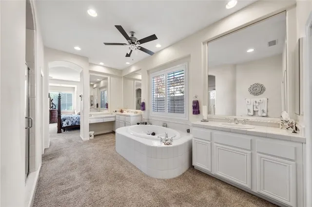 a bathroom with a bathtub and a sink