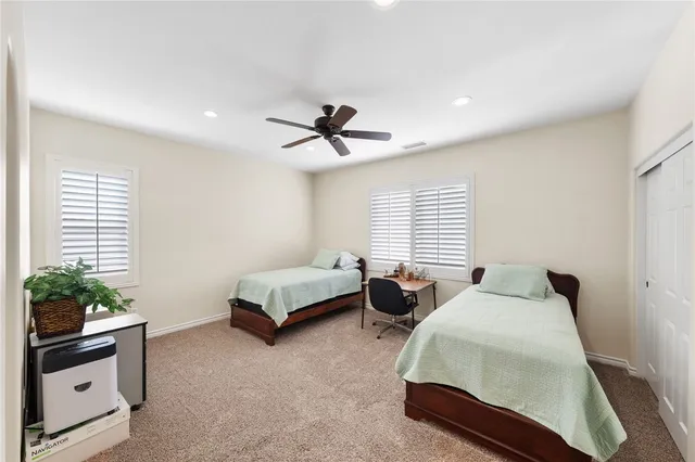 a view of backyard with outdoor seating and plants