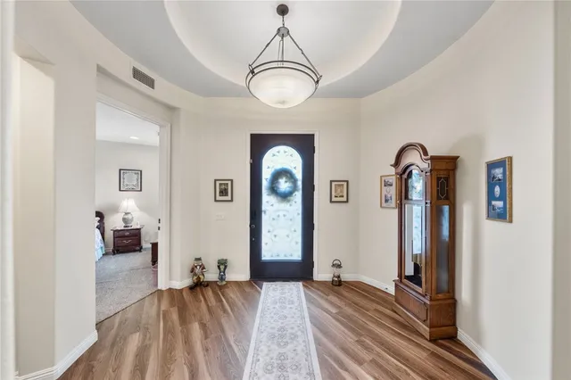 a view of a dining room with furniture entryway and wooden floor