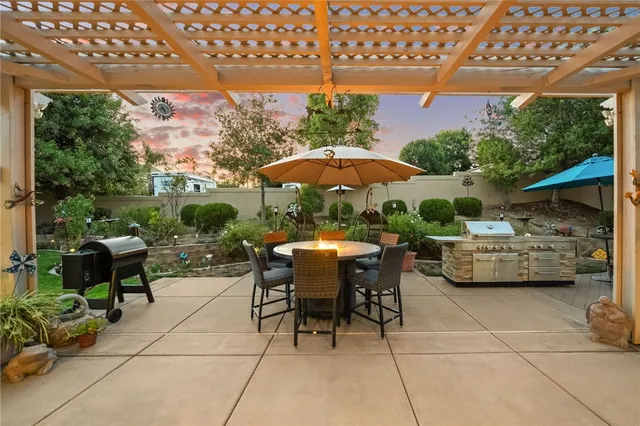 an aerial view of a house with yard swimming pool and outdoor seating