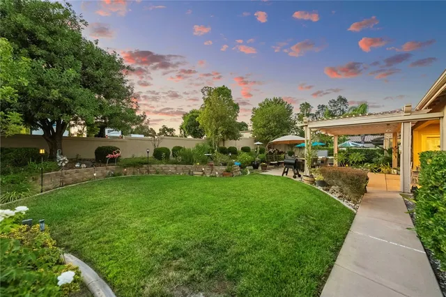 a view of a field with a mountain in the background