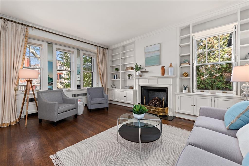 1045 Devon Road Pittsburgh, PA 15213 - Photo 12 of 25 a living room with furniture a fireplace and a large window