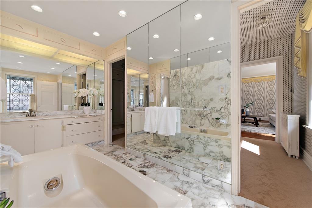 1045 Devon Road Pittsburgh, PA 15213 - Photo 17 of 25 a bathroom with a tub a sink a mirror and a shower