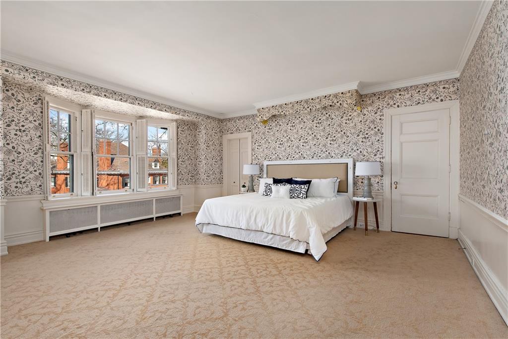 1045 Devon Road Pittsburgh, PA 15213 - Photo 18 of 25 a bed sitting in a spacious bedroom next to a window