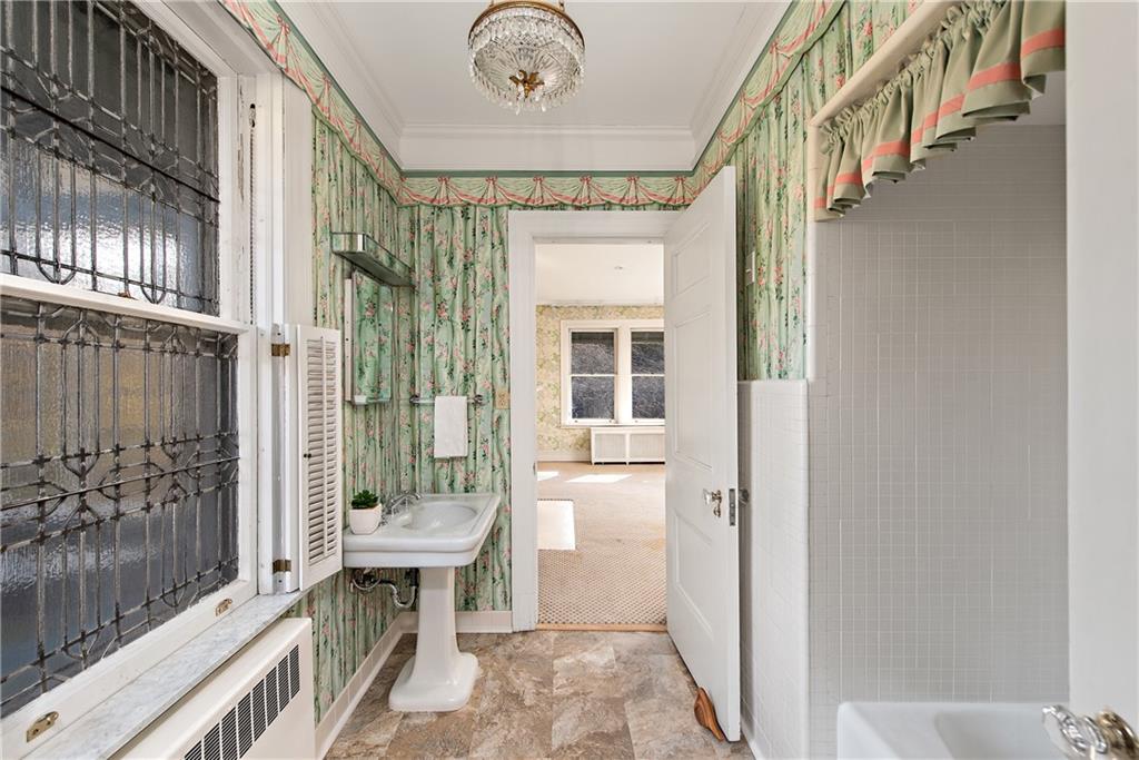 1045 Devon Road Pittsburgh, PA 15213 - Photo 22 of 25 a bathroom with a tub and shower