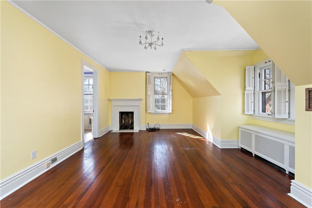 1045 Devon Road Pittsburgh, PA 15213 - Photo 24 of 25 a view of an empty room with wooden floor and a window