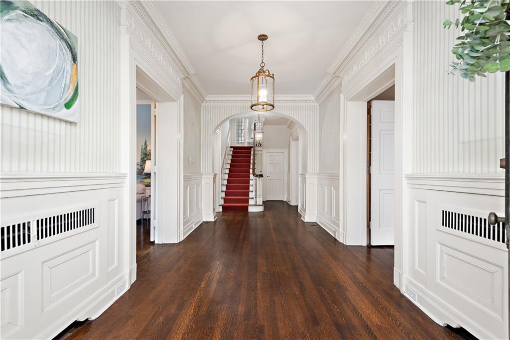 1045 Devon Road Pittsburgh, PA 15213 - Photo 4 of 25 a view of a hallway with wooden floor and entryway