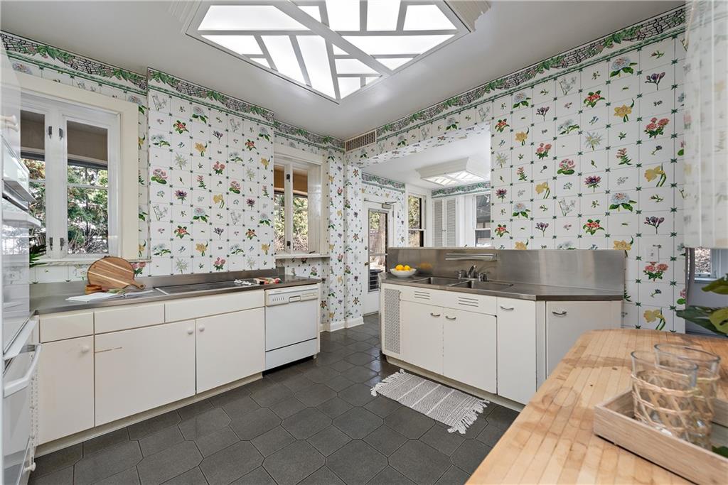 1045 Devon Road Pittsburgh, PA 15213 - Photo 9 of 25 a large white kitchen with a sink and cabinets