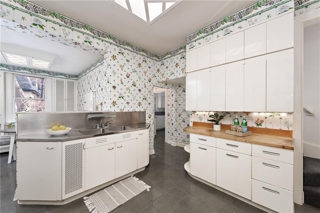 1045 Devon Road Pittsburgh, PA 15213 - Photo 10 of 25 a kitchen with a sink a stove and cabinets