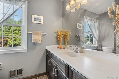 a bathroom with a sink and a mirror