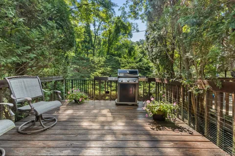 a view of a chairs and table on the wooden floor