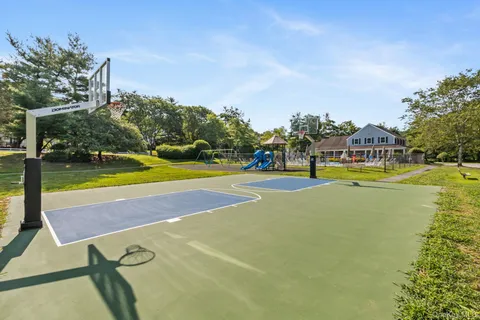 a view of a swimming pool with an outdoor space and seating area