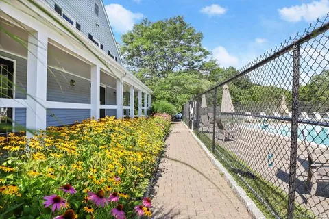a view of a house with a flower garden