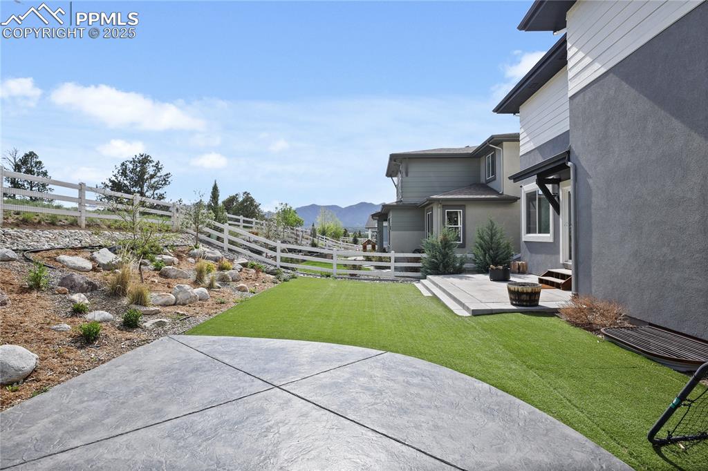 11848 Alydar Loop Colorado Springs, CO 80921 - Photo 43 of 50 View of yard with a patio area and a mountain view