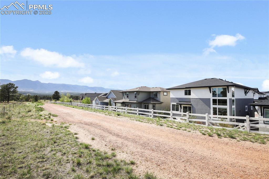 11848 Alydar Loop Colorado Springs, CO 80921 - Photo 49 of 50 View of dirt / gravel road with a mountain view