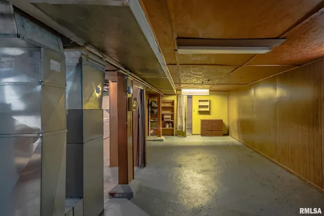 a view of a hallway with wooden shelves