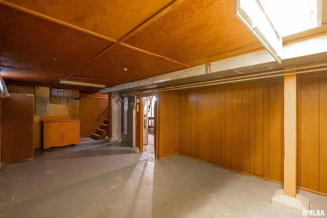 a view of a room with wooden walls