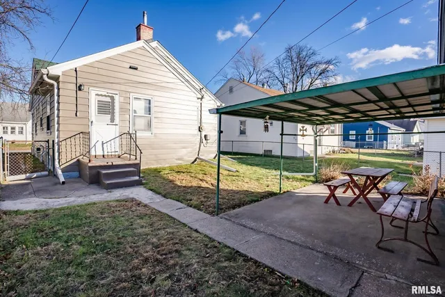 a view of a backyard with sitting area