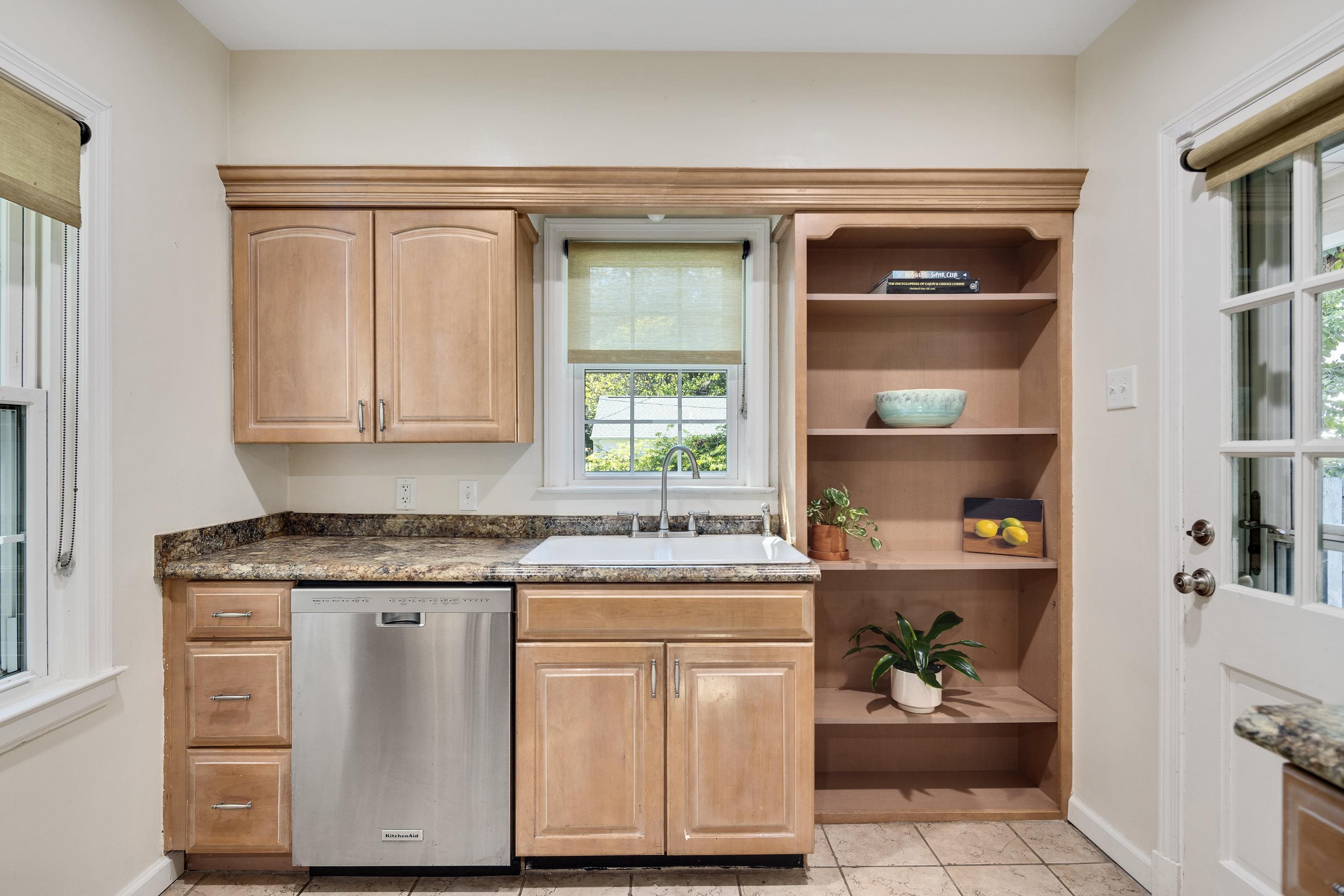73 North Goodlett Street Memphis, TN 38117 - Photo 14 of 36 a kitchen with a sink cabinets and a window