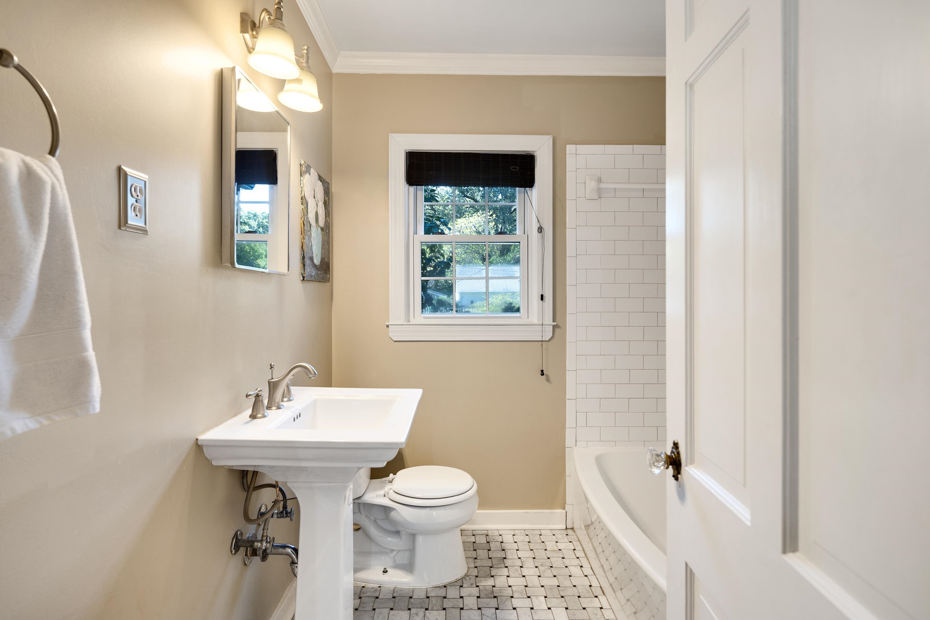 73 North Goodlett Street Memphis, TN 38117 - Photo 20 of 36 a bathroom with a sink toilet and shower