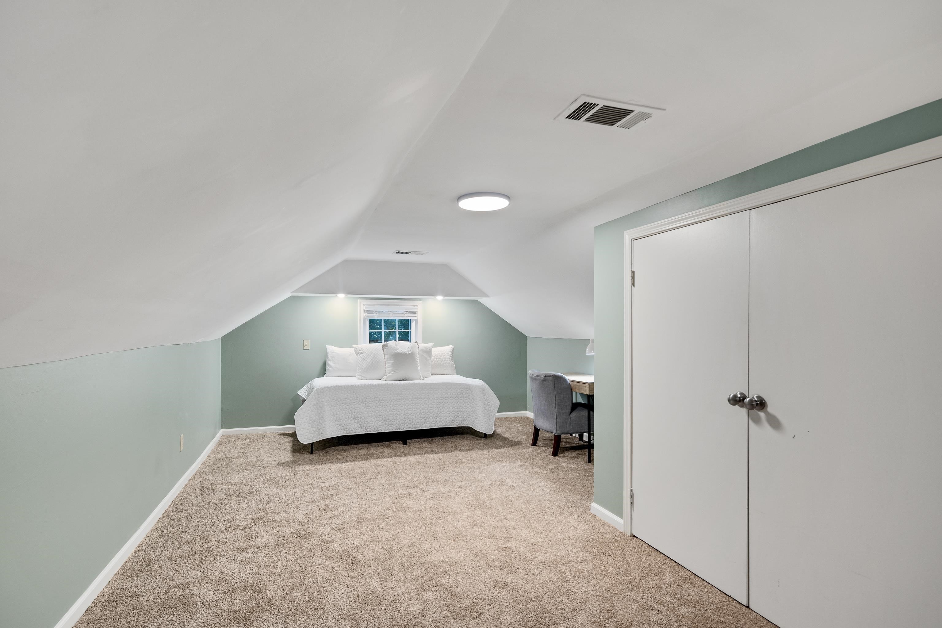 73 North Goodlett Street Memphis, TN 38117 - Photo 23 of 36 a bedroom with a bed and a view of bathroom