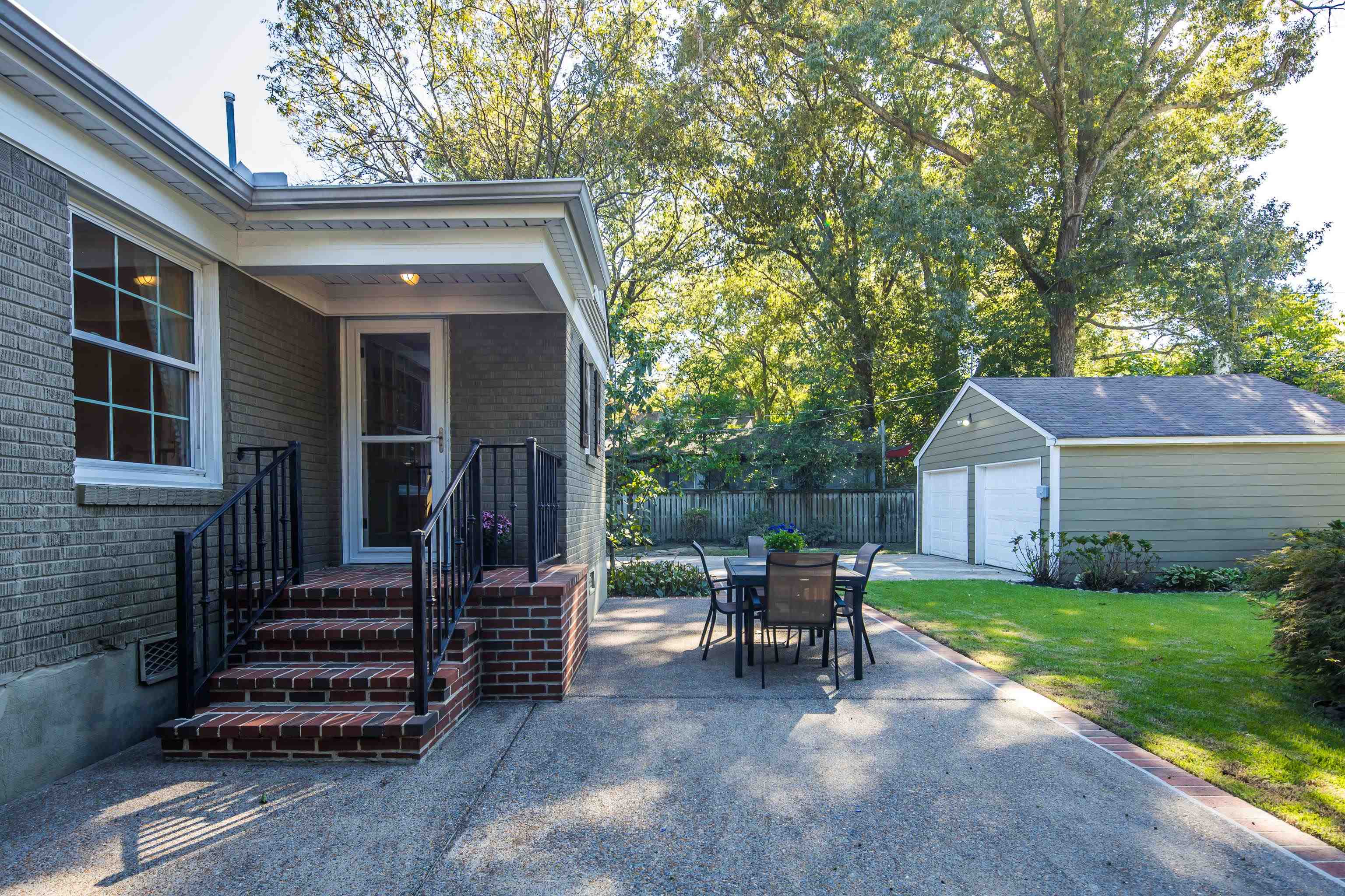 73 North Goodlett Street Memphis, TN 38117 - Photo 32 of 36 a view of a house with backyard and chairs