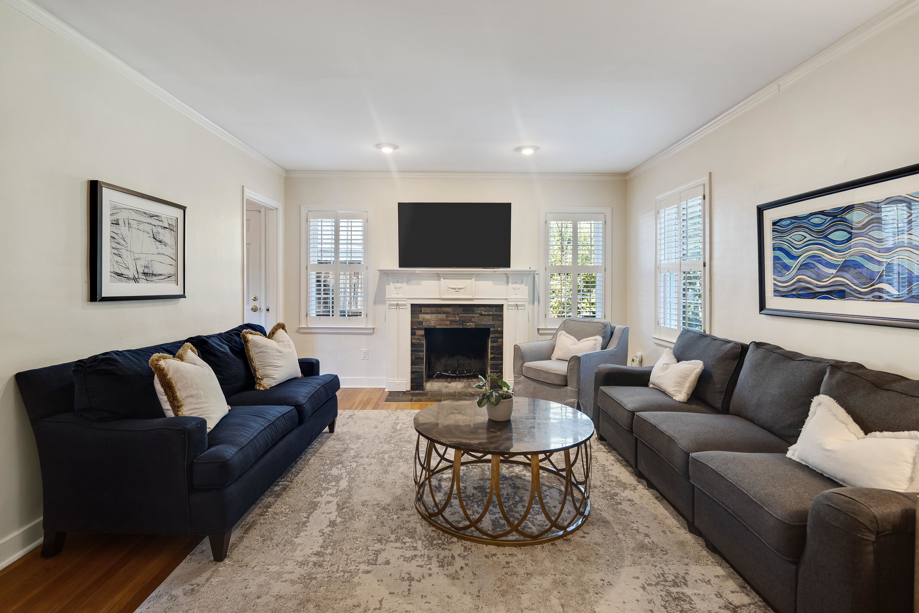 73 North Goodlett Street Memphis, TN 38117 - Photo 7 of 36 a living room with furniture fireplace and a flat screen tv