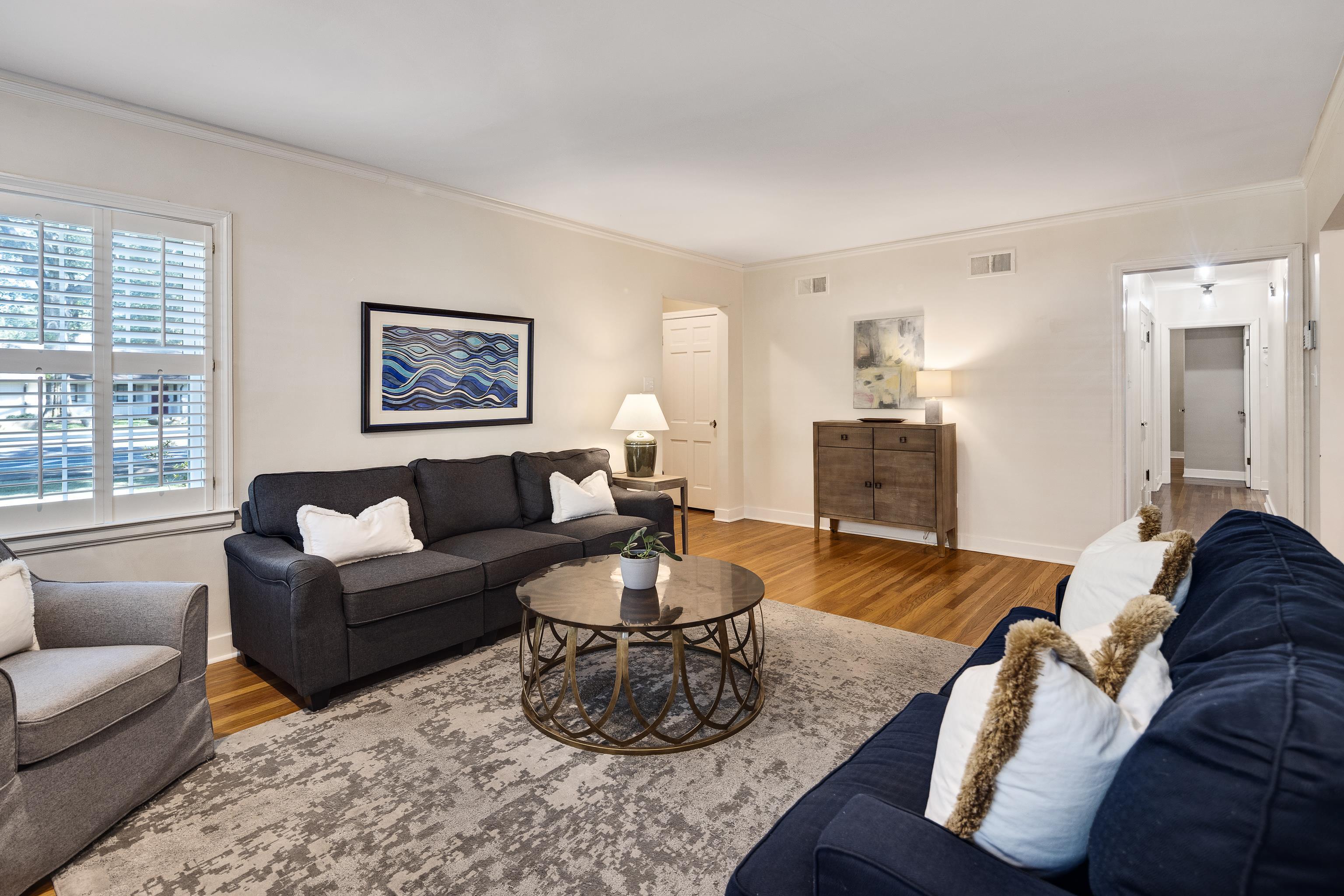 73 North Goodlett Street Memphis, TN 38117 - Photo 8 of 36 a living room with furniture potted plant and a window