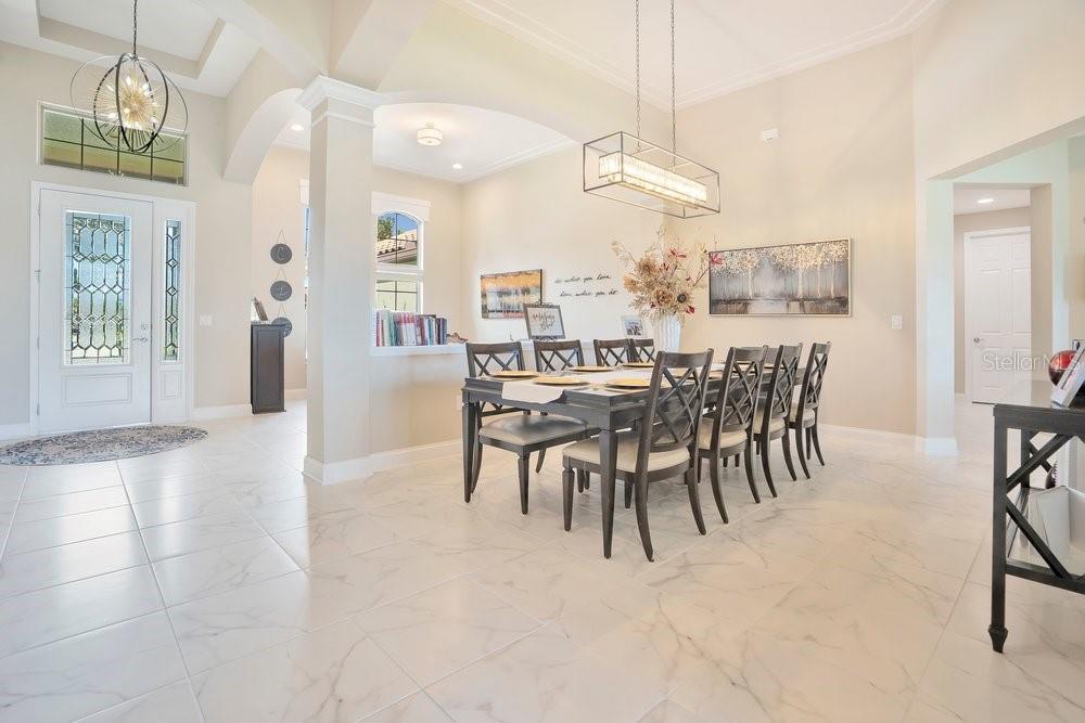 805 Riviera Bella Drive DeBary, FL 32713 - Photo 11 of 86 a view of a dining room with furniture