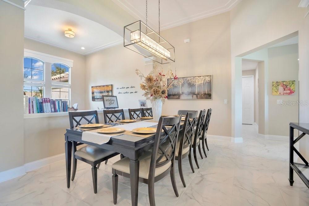 805 Riviera Bella Drive DeBary, FL 32713 - Photo 12 of 86 a dining room with furniture and window