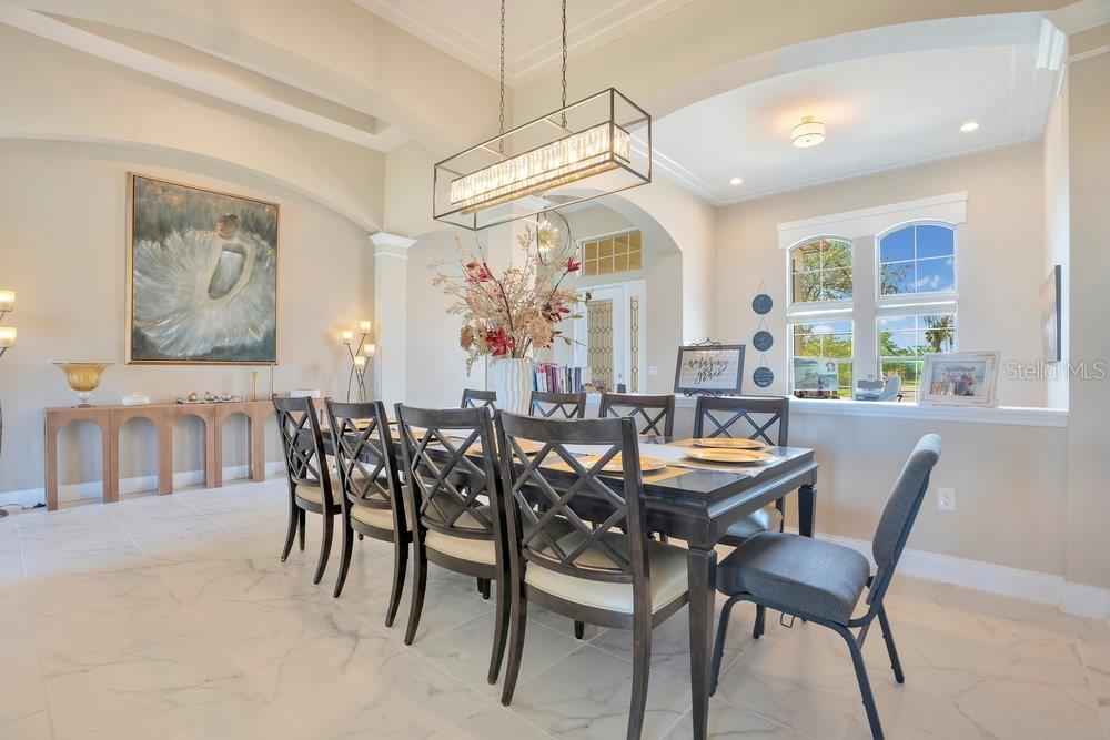 805 Riviera Bella Drive DeBary, FL 32713 - Photo 15 of 86 a dining room with furniture and window