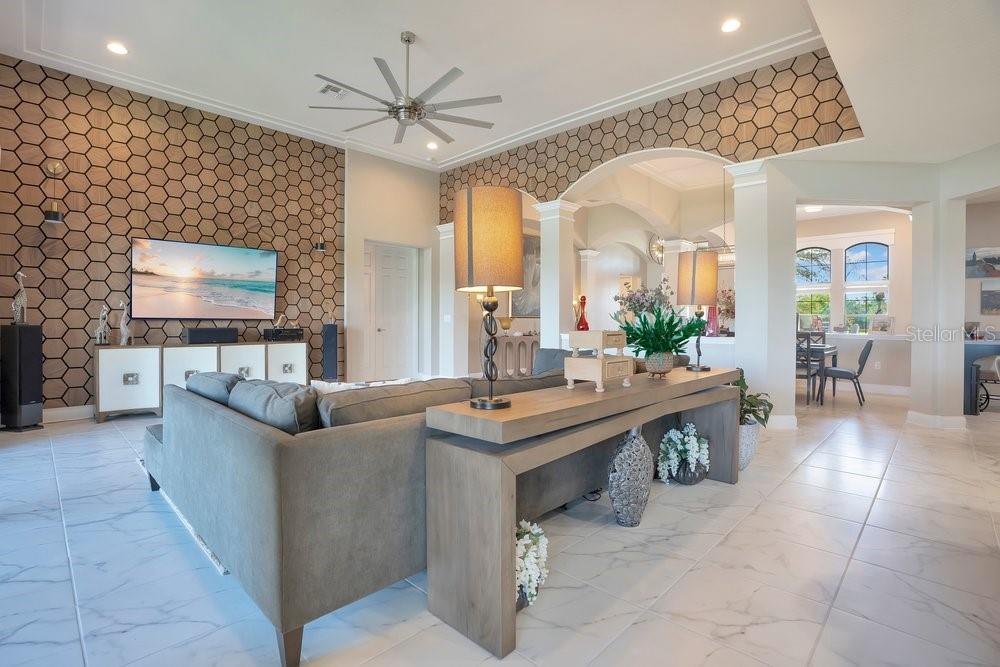 805 Riviera Bella Drive DeBary, FL 32713 - Photo 27 of 86 a living room with fireplace furniture and a flat screen tv