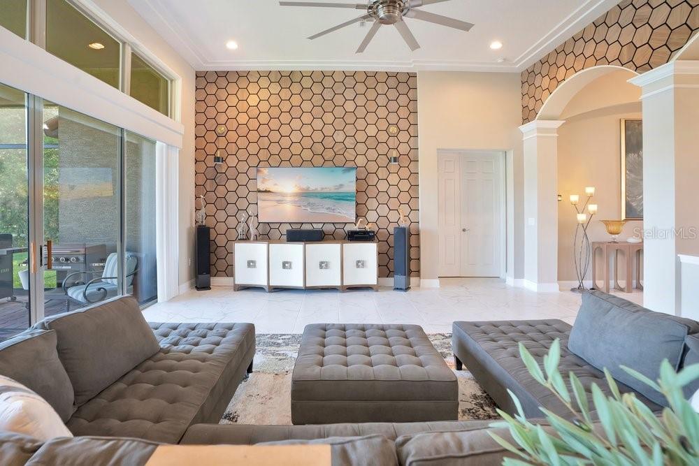 805 Riviera Bella Drive DeBary, FL 32713 - Photo 28 of 86 a living room with furniture and a flat screen tv