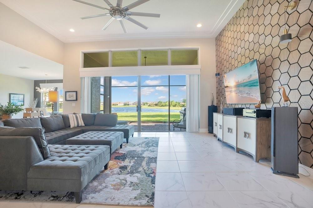 805 Riviera Bella Drive DeBary, FL 32713 - Photo 33 of 86 a living room with furniture and a fireplace