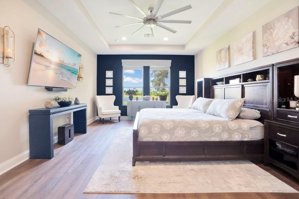 805 Riviera Bella Drive DeBary, FL 32713 - Photo 35 of 86 a large bedroom with a large bed a flat tv screen and dresser