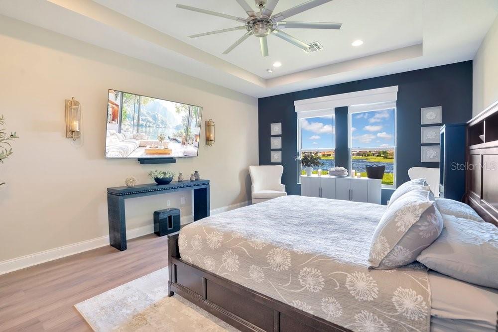 805 Riviera Bella Drive DeBary, FL 32713 - Photo 37 of 86 a bedroom with a bed and a table